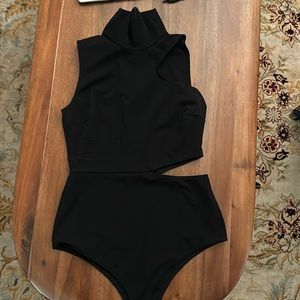 Wolford mock neck black sleeveless cut out on side